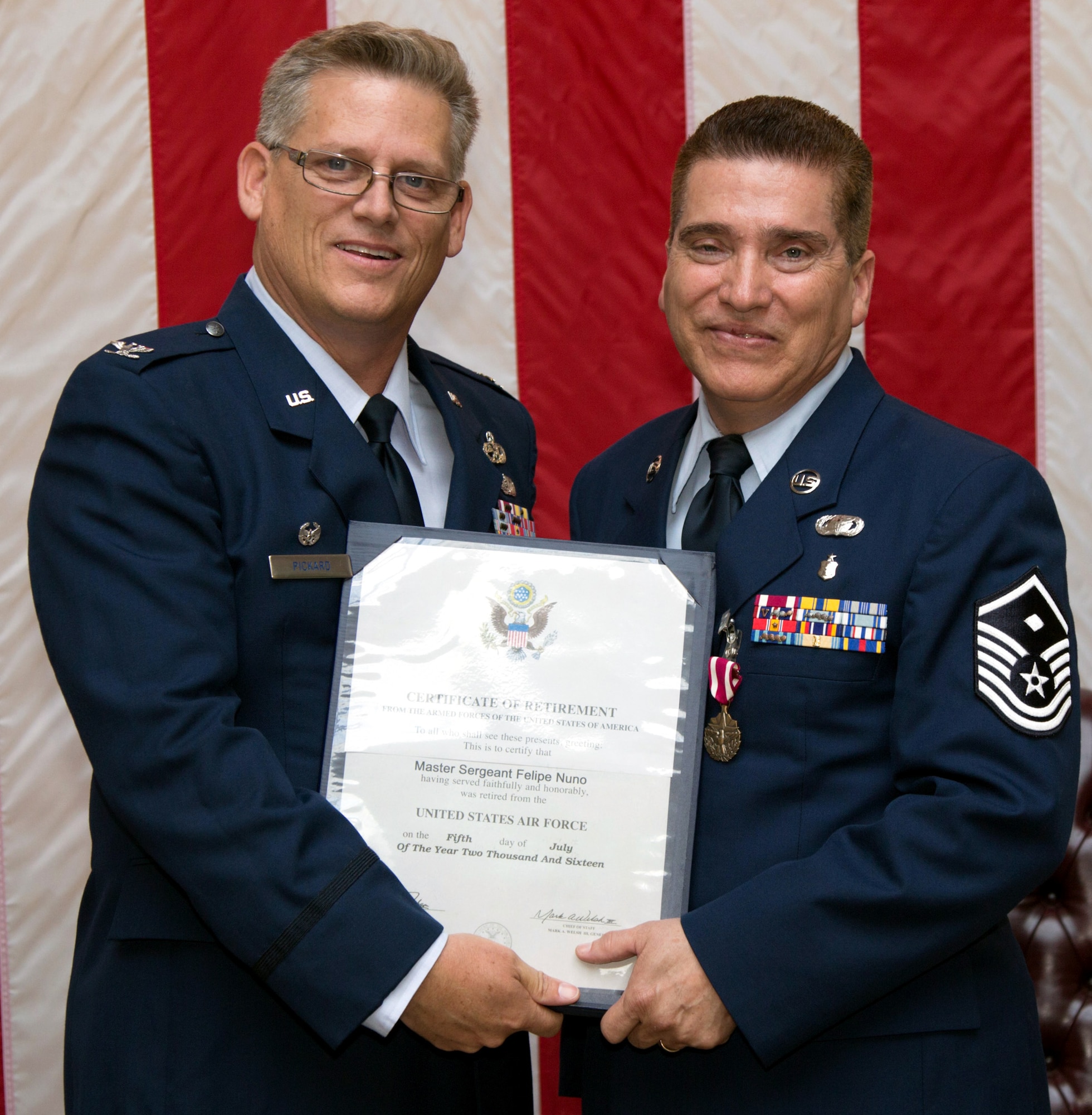 Master Sgt. Felipe Nuno, 349th Maintenance Group first sergeant, is honored in a retirement ceremony at Travis Air Force Base, Calif., Aug. 27, 2016. Nuno served 33 years, all of it in the 349th Air Mobility Wing. (U.S. Air Force Photo by Lt. Col. Robert Couse-Baker)