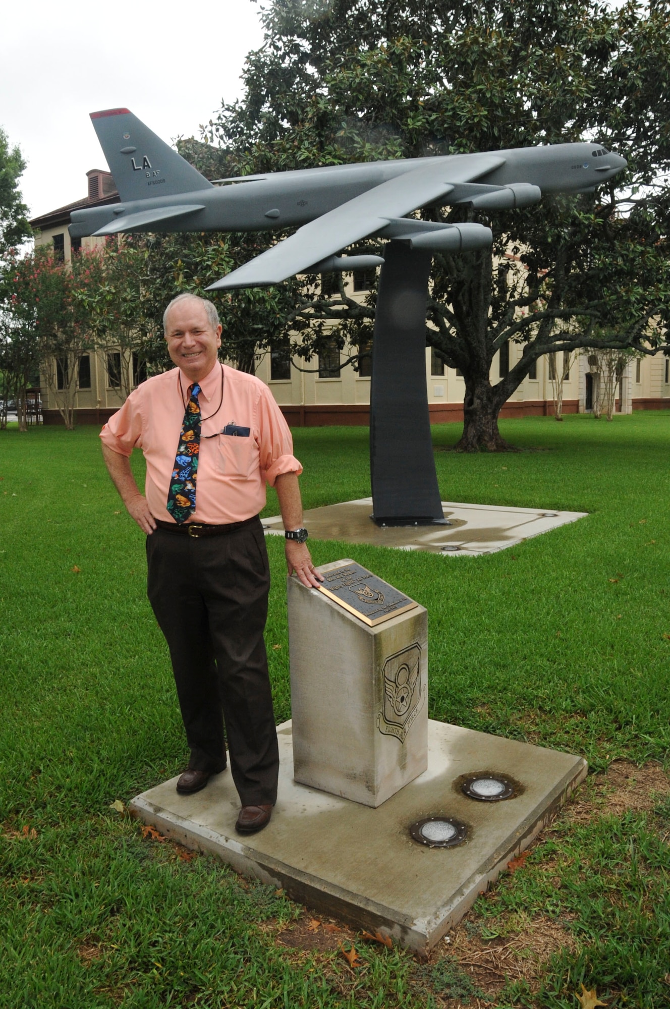 Ed Wempe stands beside the B-52 static display outside the Headquarters Eighth Air Force building at Barksdale AFB, La., Aug. 15, 2016, days before his retirement from the Intelligence career field. Wempe has produced countless numbers of targeting and threat analysis reports for B-52 aircrews throughout the span of a 45-year career. (U.S. Air Force photo by Amn Alexis Schultz)