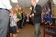 Ed Wempe passes out gifts to family members for supporting him during his 45-year career in the Intelligence field at a retirement ceremony at Barksdale AFB, La., Aug. 18, 2016.