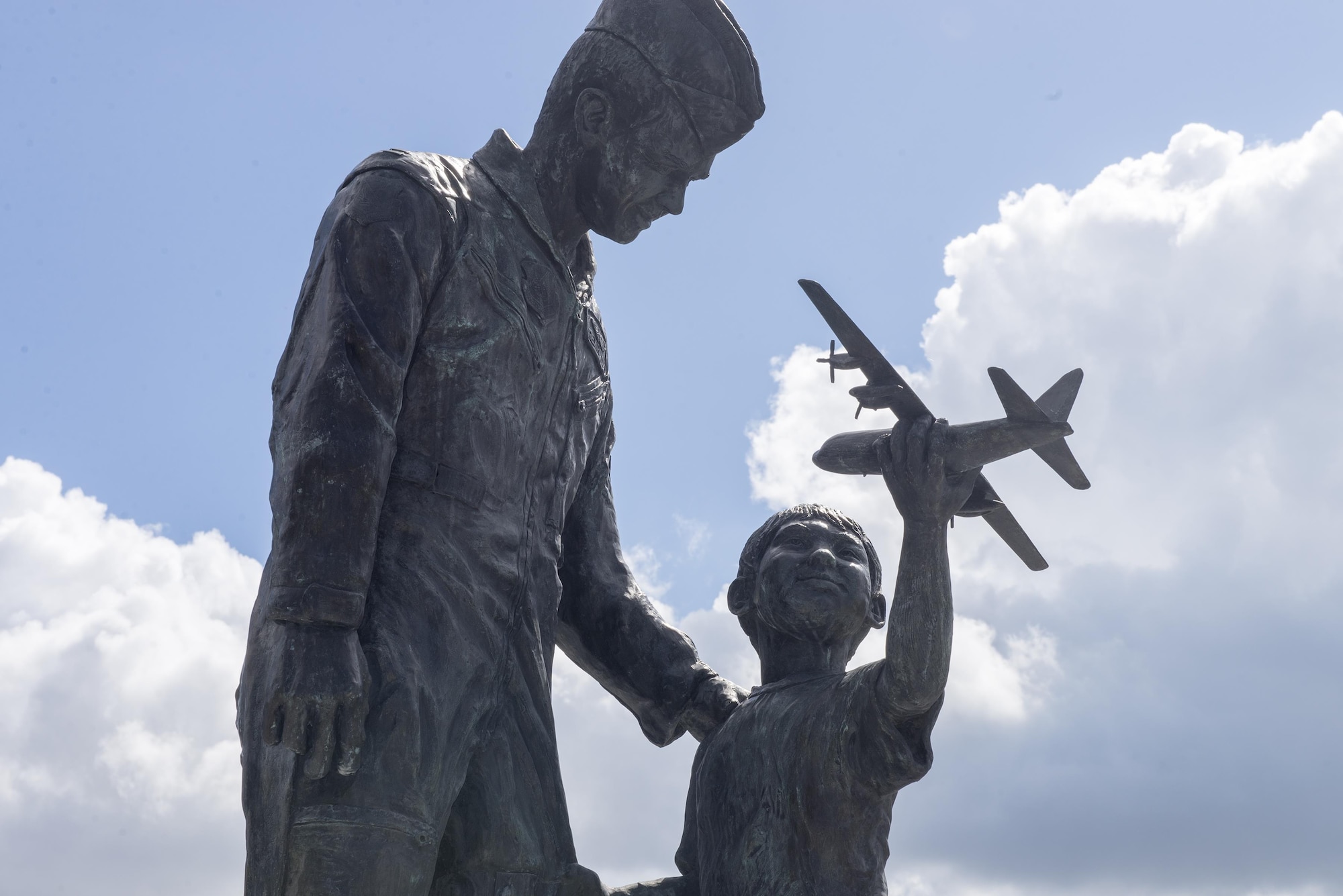 The Tomodachi statue, built on May 31, 2001, by a Yokota High School art teacher and his students commemorating the friendship between the U.S. and Japan, stands on a median on Friendship Boulevard at Yokota Air Base, Japan, Aug. 25, 2016. More than 60 students collaborated to make the statue, using 550 pounds of clay. (U.S. Air Force photo by Senior Airman David C. Danford/Released)