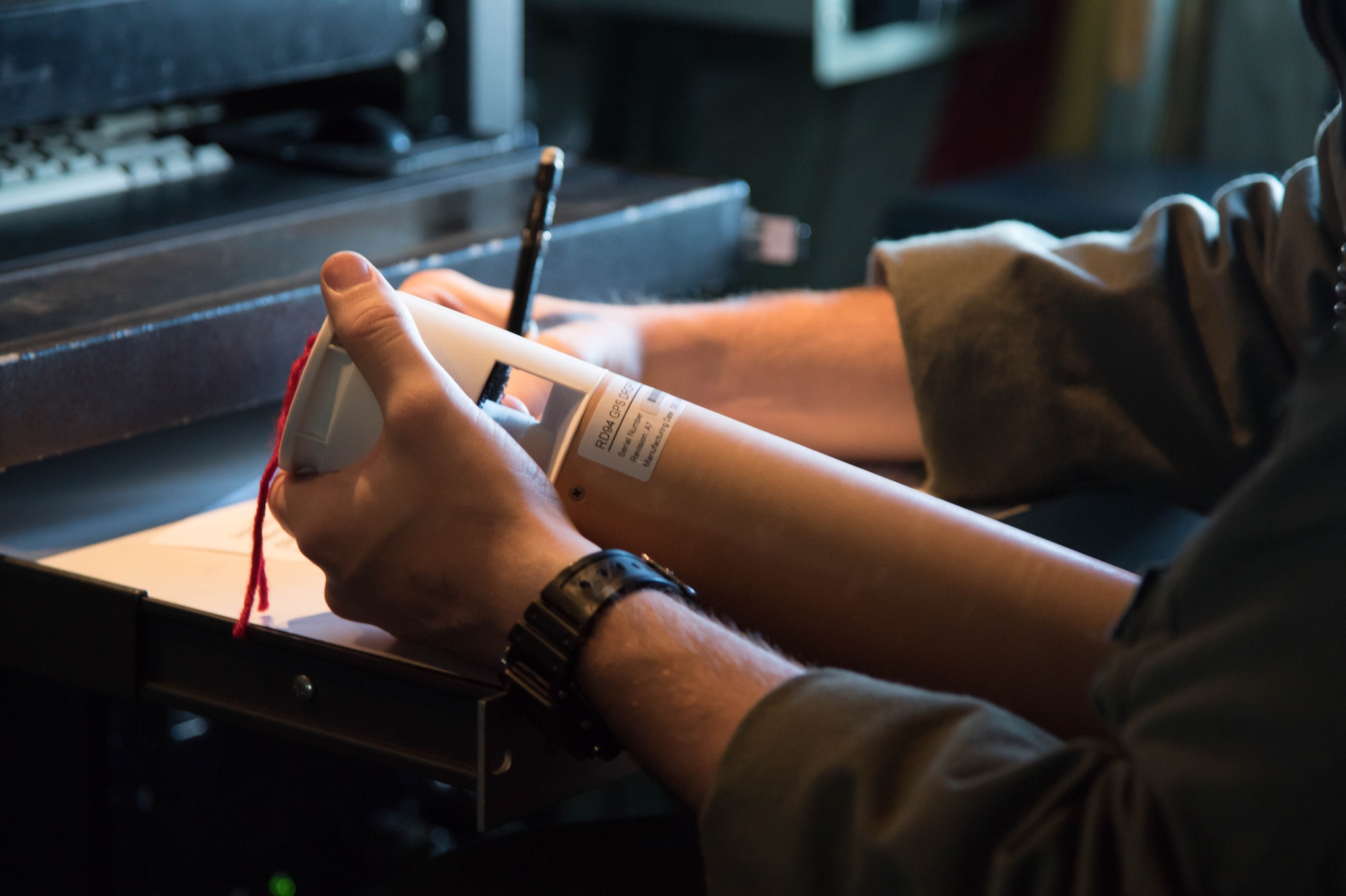 Tech. Sgt. Tobi Baker checks a dropsonde during a flight into Hurricane Hermine Sept. 1, 2016 (U.S. Air Force photo by Senior Airman Heather Heiney