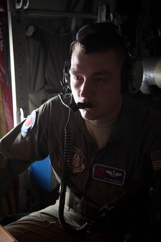 Tech Sgt. Tom Barnaby, 53rd Weather Reconnaissance Squadron loadmaster, prepares to launch a dropsonde during a flight into Hurricane Hermine Sept. 1, 2016 (U.S. Air Force photo by Senior Airman Heather Heiney