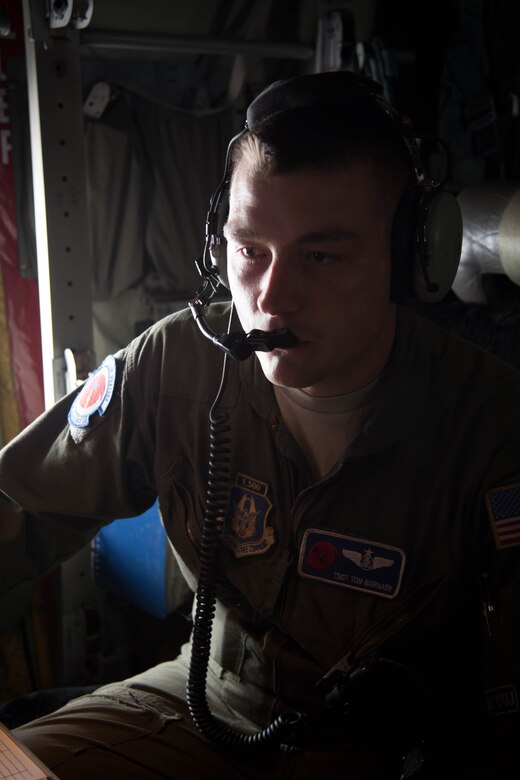 Tech Sgt. Tom Barnaby, 53rd Weather Reconnaissance Squadron loadmaster, prepares to launch a dropsonde during a flight into Hurricane Hermine Sept. 1, 2016 (U.S. Air Force photo by Senior Airman Heather Heiney