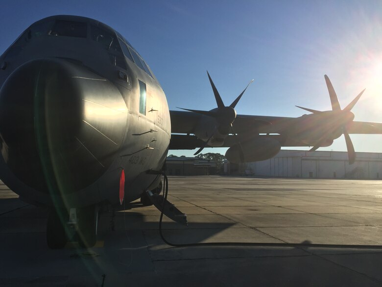 The sun rises behind a WC-130J as its crew prepares to fly into Hurricane Hermine Sept. 1, 2016. (U.S. Air Force photo by Senior Airman Heather Heiney)