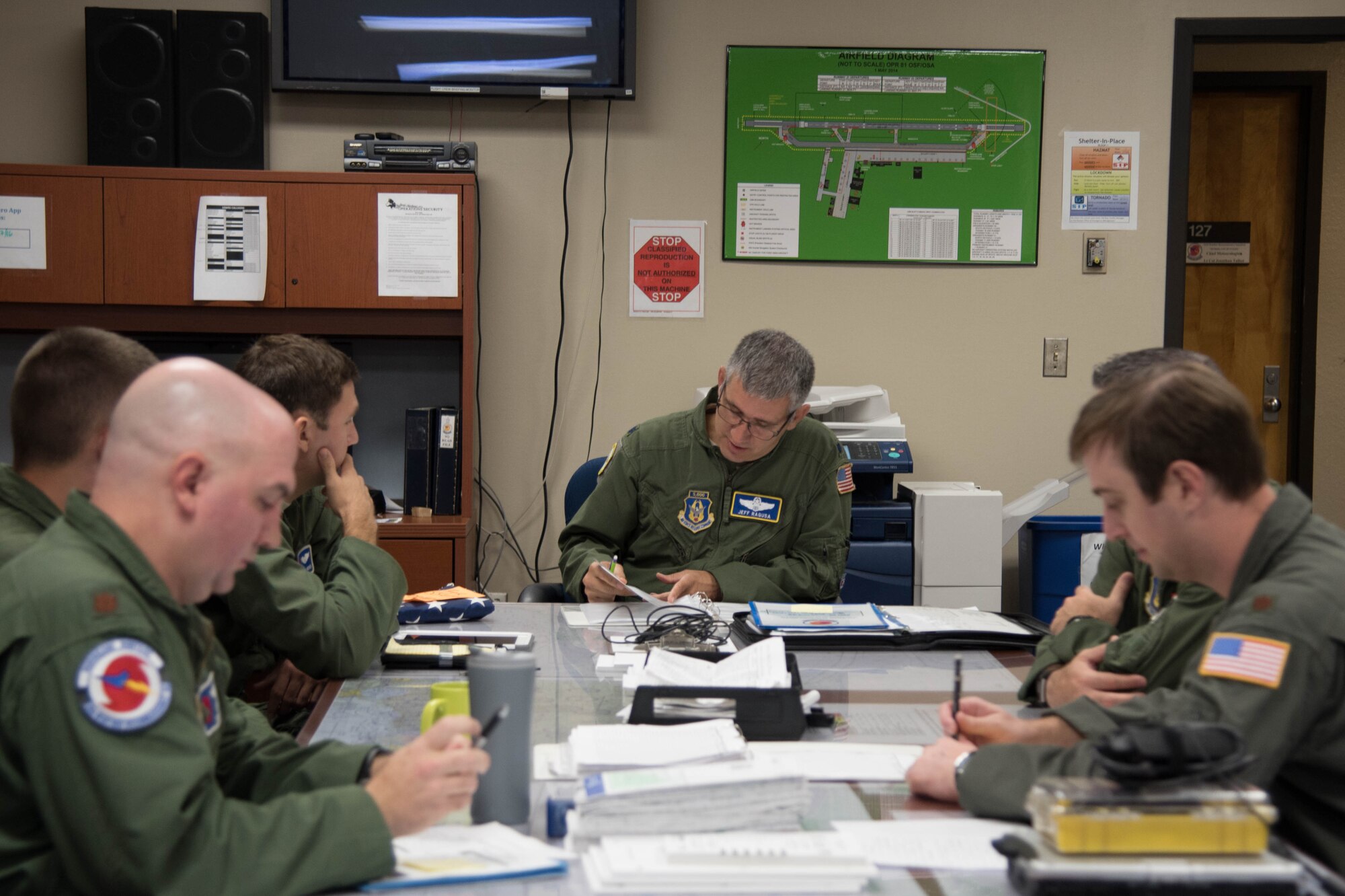 Lt. Col. Jeff Ragusa, 53rd Weather Reconnaissance Squadron pilot and aircraft commander for Teal 72 leads a briefing to prepare the crew for a flight into Hurricane Hermine Sept. 1, 2016 (U.S. Air Force photo by Senior Airman Heather Heiney