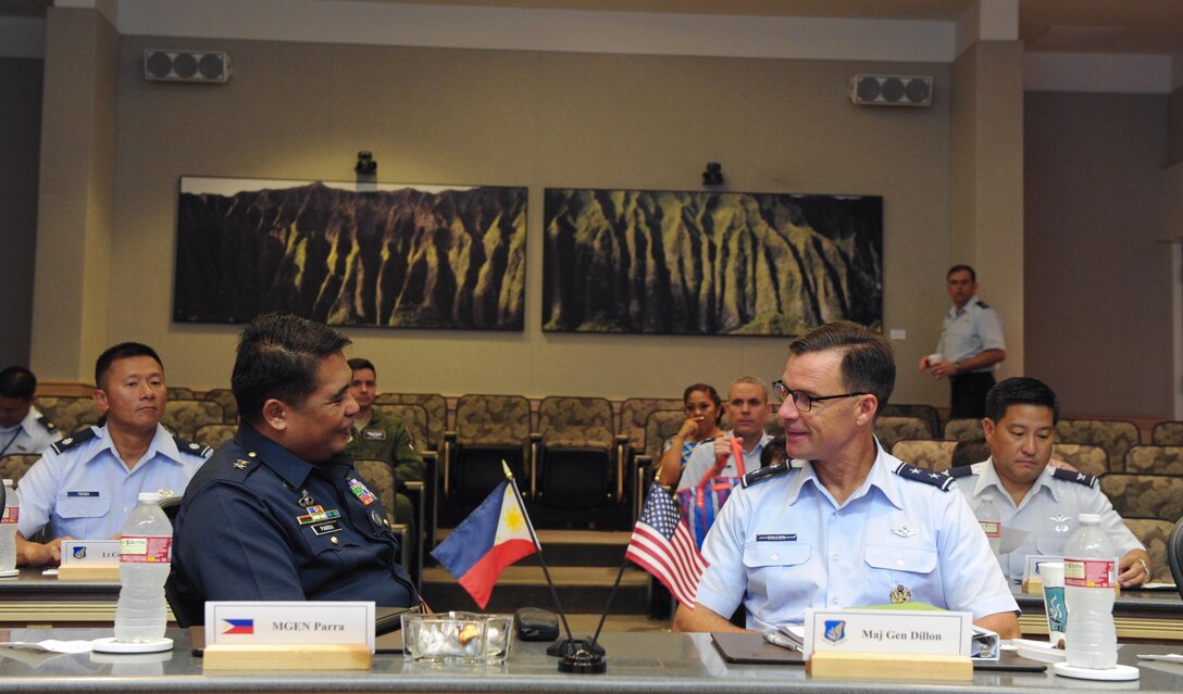 Maj. Gen. Conrado V. Parra, Jr., Philippine Air Force vice commander, left, and Maj. Gen. Mark Dillon, Pacific Air Forces vice commander, discuss topics of concern during the fifth annual U.S. and Philippine Airman-to-Airman Talks at Joint Base Pearl Harbor-Hickam, Hawaii, Aug. 30, 2016.  The goals of the three-day conference were synchronizing planning between the U.S. Air Force and Philippine Air Force, shaping engagement priorities, strengthening the bilateral relationship with the PAF and focusing on a 3 to 5 year outlook for PACAF-PAF activities. (U.S. Air Force photo by Staff Sgt. Kamaile O. Chan)