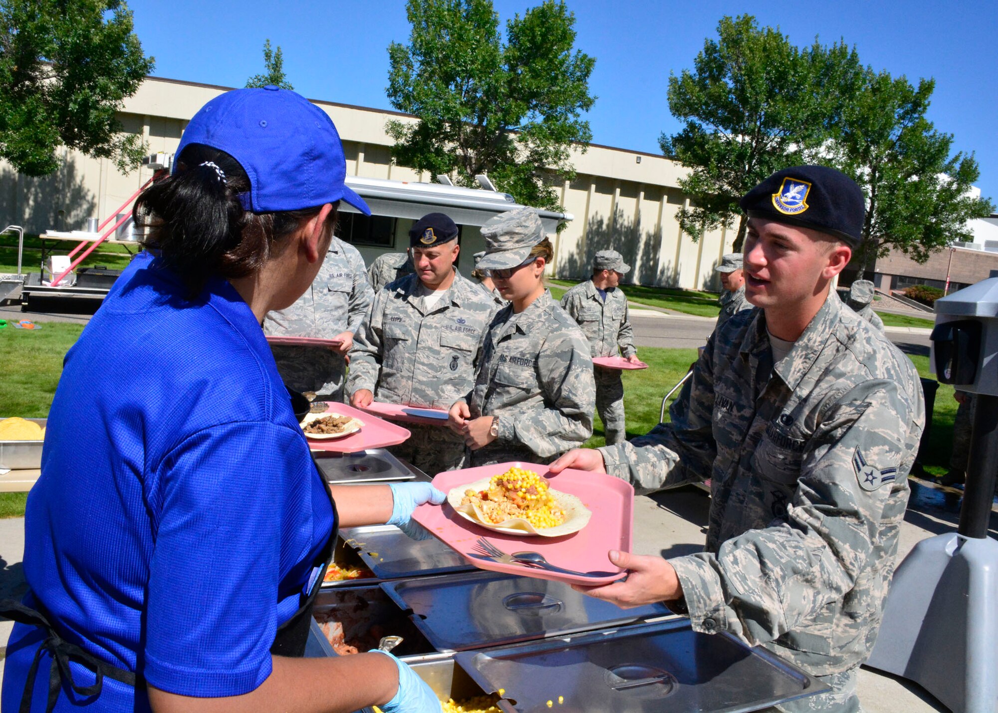 120th Security Forces Squadron Airman 1st Class Galen Sullivan is served a meal prepared from the DRMKT (Disaster Relief Mobile Kitchen Trailer) during the guard drill held at the 120th Airlift Wing in Great Falls, Mont. Aug. 13, 2016. (U.S. Air National Guard photo by Senior Master Sgt. Eric Peterson) 