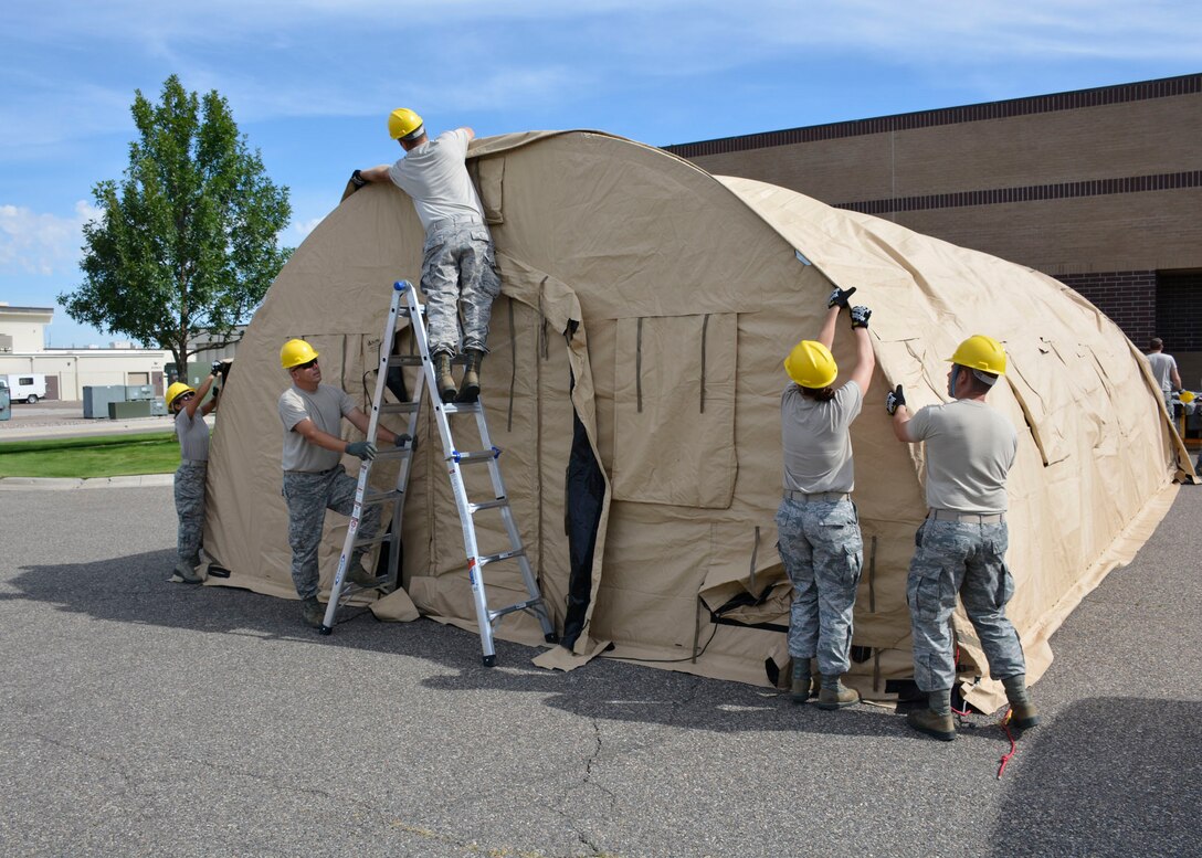 Members of the 120th Sustainment Services Flight construct an Alaska Small Shelter System during the guard drill at the 120th Airlift Wing in Great Falls, Mont. Aug. 13, 2016. (U.S. Air National Guard photo by Senior Master Sgt. Eric Peterson)