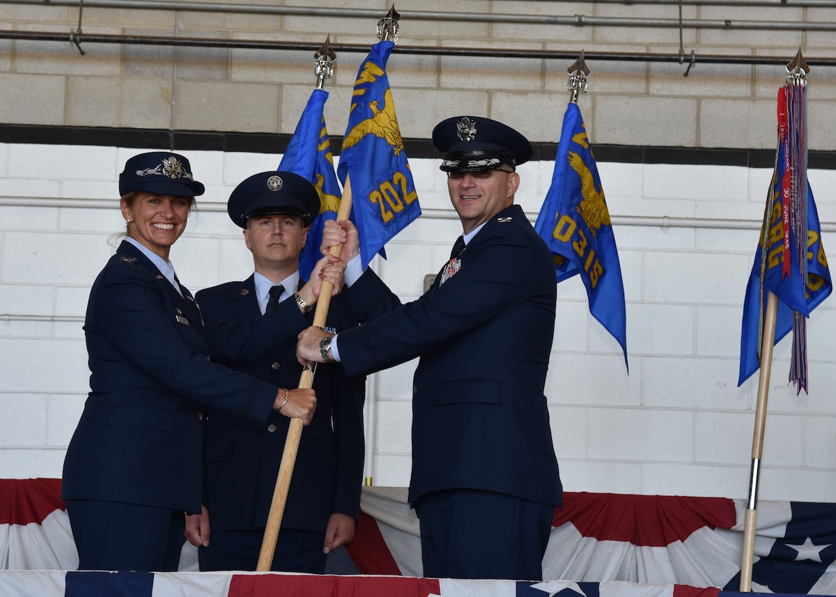 Otis Air National Guard Base, Cape Cod, Massachusetts —The 202nd Intelligence Surveillance Reconnaissance Group and its three squadrons assumption of command ceremony.  Col. Virginia Doonan, 102nd Intelligence Wing Commander, passes the guidon for the 202nd Cyber Intelligence Surveillance Reconnaissance Group to Col. Joseph F. Morrissey Jr. in a ceremony symbolizing his assumption of command of the group.  (U.S. Air National Guard Photos by Tech. Sgt. Lindsey Sarah Watson-Kirwin/released)