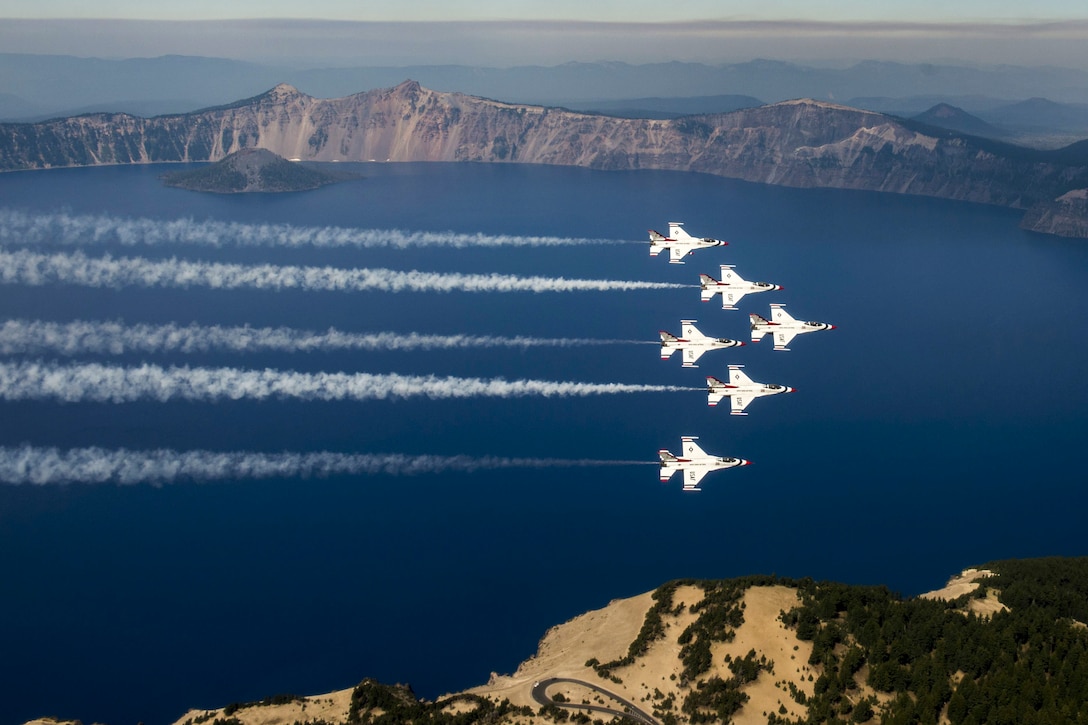 Pilots assigned to the Thunderbirds, the Air Force's demonstration squadron, fly over Crater Lake, Ore., Aug. 29, 2016. The Thunderbirds returned to Nellis Air Force Base, Nev., after performing at the Airshow and Warrior Expo at Joint Base Lewis-McChord, Wash. Air Force photo by Tech. Sgt. Christopher Boitz