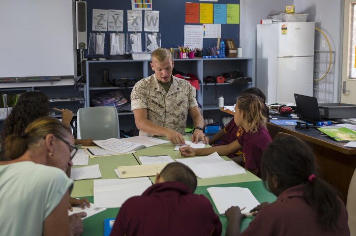 U.S. Marine Corps Cpl. Cody Braunscheidel, an aviation logistics information management systems specialist assigned to Marine Fighter Attack Squadron (VMFA) 122, explains multiplication to students at MacFarlane Primary School in Katherine, Northern Territory, Australia, Sept. 1, 2016. Marines are invited to mentor and teach students every iteration of Southern Frontier, a three week unit level training conducted by U.S. Marines at Royal Australian Air Force Base Tindal. The primary school’s student population is 92 percent indigenous and is very transient. Classes are designed to provide students structure and a consolidated education in literacy, numeracy, respect and behavior management. (U.S. Marine Corps photo by Cpl. Nicole Zurbrugg)