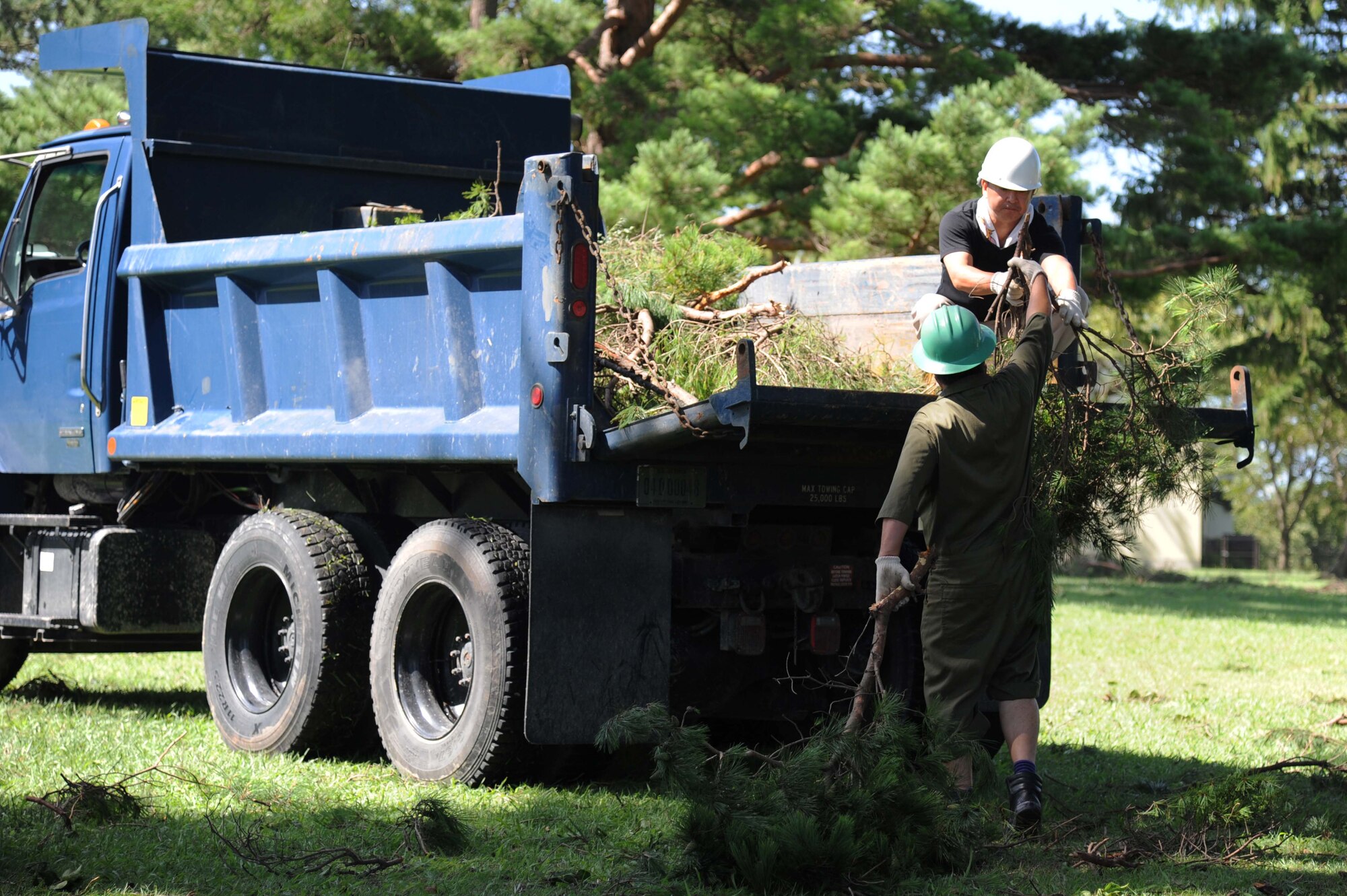 Members of the 35th Civil Engineer Squadron, operations section, clean up fallen debris at Misawa Air Base, Japan, Aug. 31, 2016.  The 35th CES responded the morning after the storm and began clean up around the base. (U.S. Air Force photo by Tech. Sgt. April Quintanilla)