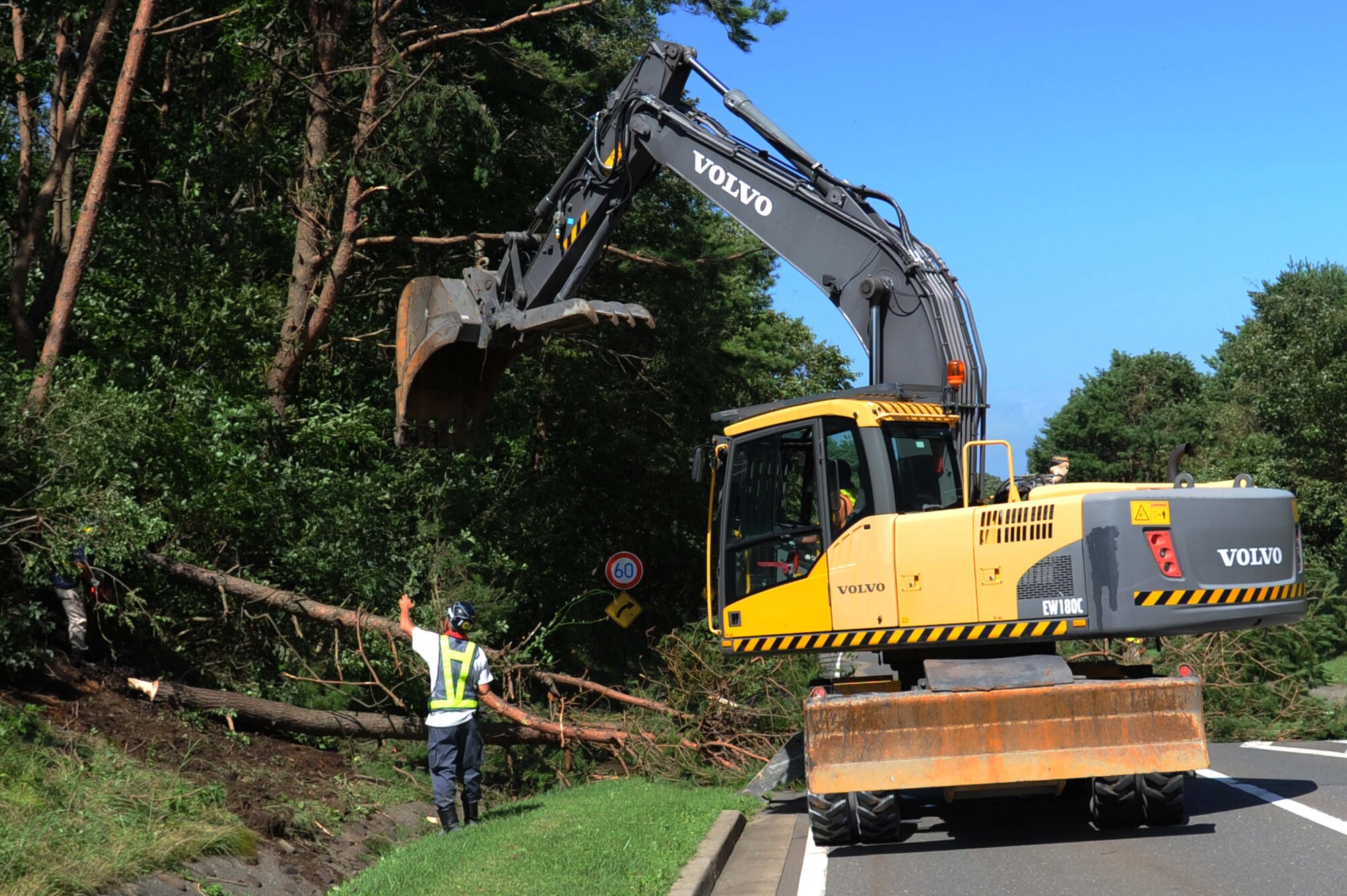 Members of the 35th Civil Engineer Squadron remove fallen trees from road ways at Misawa Air Base, Japan, Aug. 31, 2016. The 35th CES responded the morning after the storm and began clean up around the base.  (U.S. Air Force photo by Tech. Sgt. April Quintanilla)