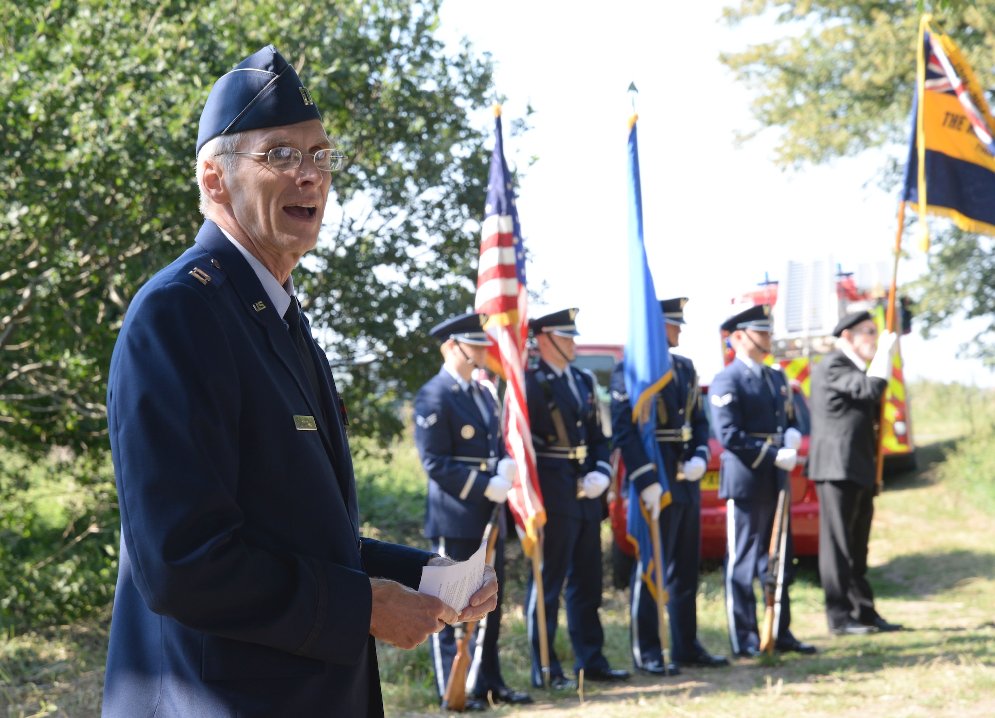 U.S. Air Force Capt. David McGuire, 100th Air Refueling Wing chaplain, left, gives an invocation and greets attendants of the Thorney Dyke 40th Anniversary Aug. 30, 2016, in Thorney, England. A C-141 Starlifter from the 438th Military Airlift Wing, McGuire Air Force Base crashed Aug. 28, 1976, at this location during a severe thunderstorm in route to RAF Mildenhall, England. All 14 crew members and four passengers lost their lives that day. (U.S. Air Force photo by Senior Airman Justine Rho)