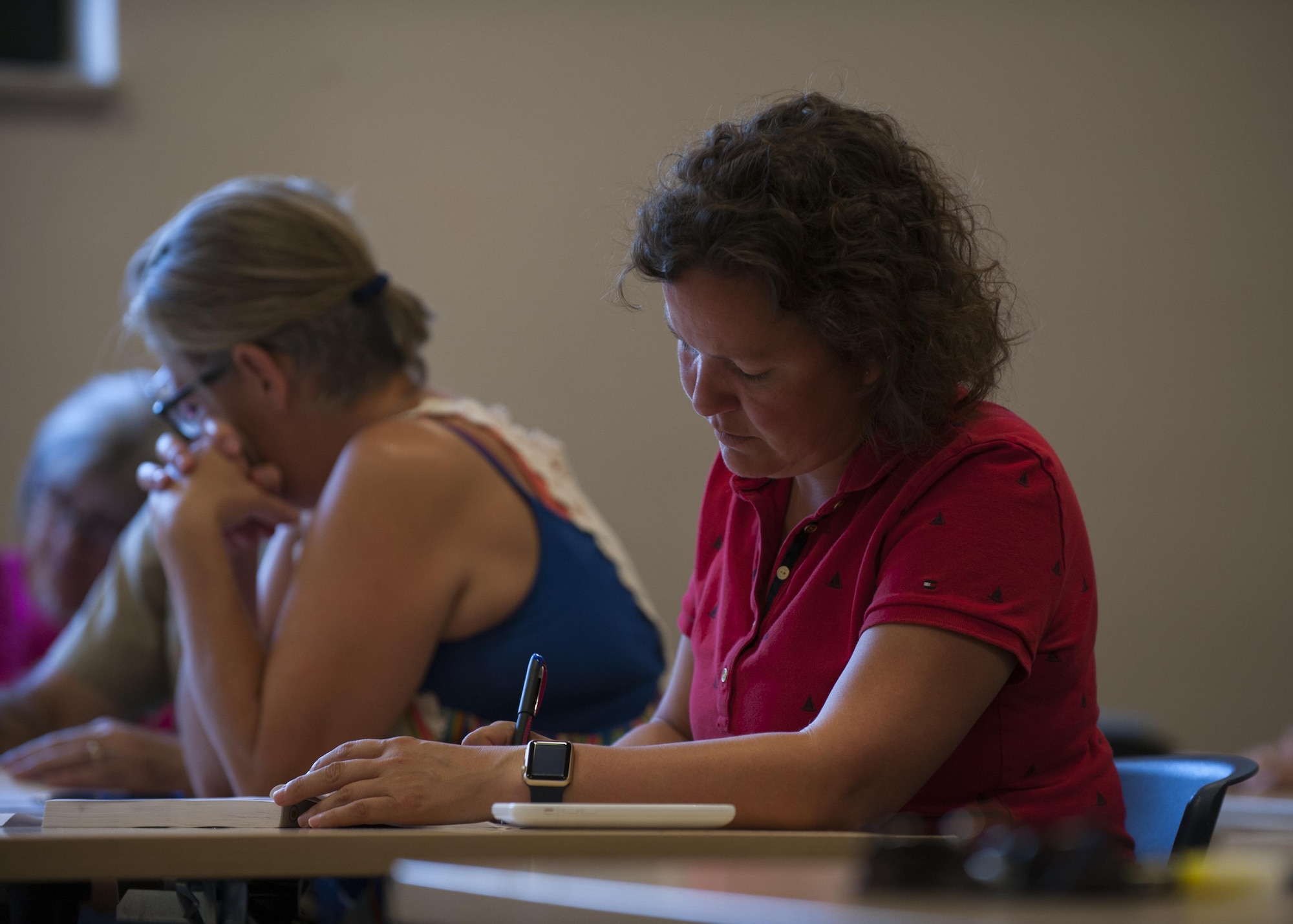 Wendy Navas, a German course student, finishes a book exercise during the German 1 Aug. 30, 2016, at Ramstein Air Base, Germany. After the first course is completed, students have the option to continue to a more advanced German course. (U.S. Air Force photo/ Airman 1st Class Savannah L. Waters)

