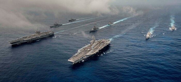 PHILIPPINE SEA - The Nimitz-class Aircraft carriers USS John C. Stennis (CVN 74) and USS Ronald Reagan (CVN 76) conduct dual aircraft carrier strike group operations in the U.S. 7th Fleet area of operations. Navy personnel evaluated virtual and hardware representations of the Stennis strike group's gun weapon systems, combat systems, and unmanned vehicles integrated with surface and air assets at the 2016 USS Dahlgren demonstration, Aug. 30. The test - made possible by a cybernetic laboratory called USS Dahlgren - proved engagement coordination across the battlegroup and live fire destruction of multiple targets from two combatants utilizing two different gun based systems. "This has been five to six years in the making and couldn't come at a better time as we see real-world events such as the recent small boat incursions in the Middle East, highlighting the need for the Fleet," said Capt. Brian Durant, NSWCDD commanding officer. 