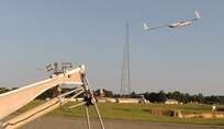 DAHLGREN, Va. - A Scan Eagle unmanned aerial vehicle (UAV) launches from the Naval Surface Warfare Center Dahlgren Division (NSWCDD) Potomac River Test Range, Aug. 30. The Scan Eagle was crucial to the Navy's evaluation of a strike group's gun weapon systems, combat systems, and unmanned vehicles integrated with surface and air assets at the 2016 USS Dahlgren demonstration. The test - made possible by a cybernetic laboratory called USS Dahlgren - proved engagement coordination across the battlegroup and live fire destruction of multiple targets from two combatants utilizing two different gun based systems. 