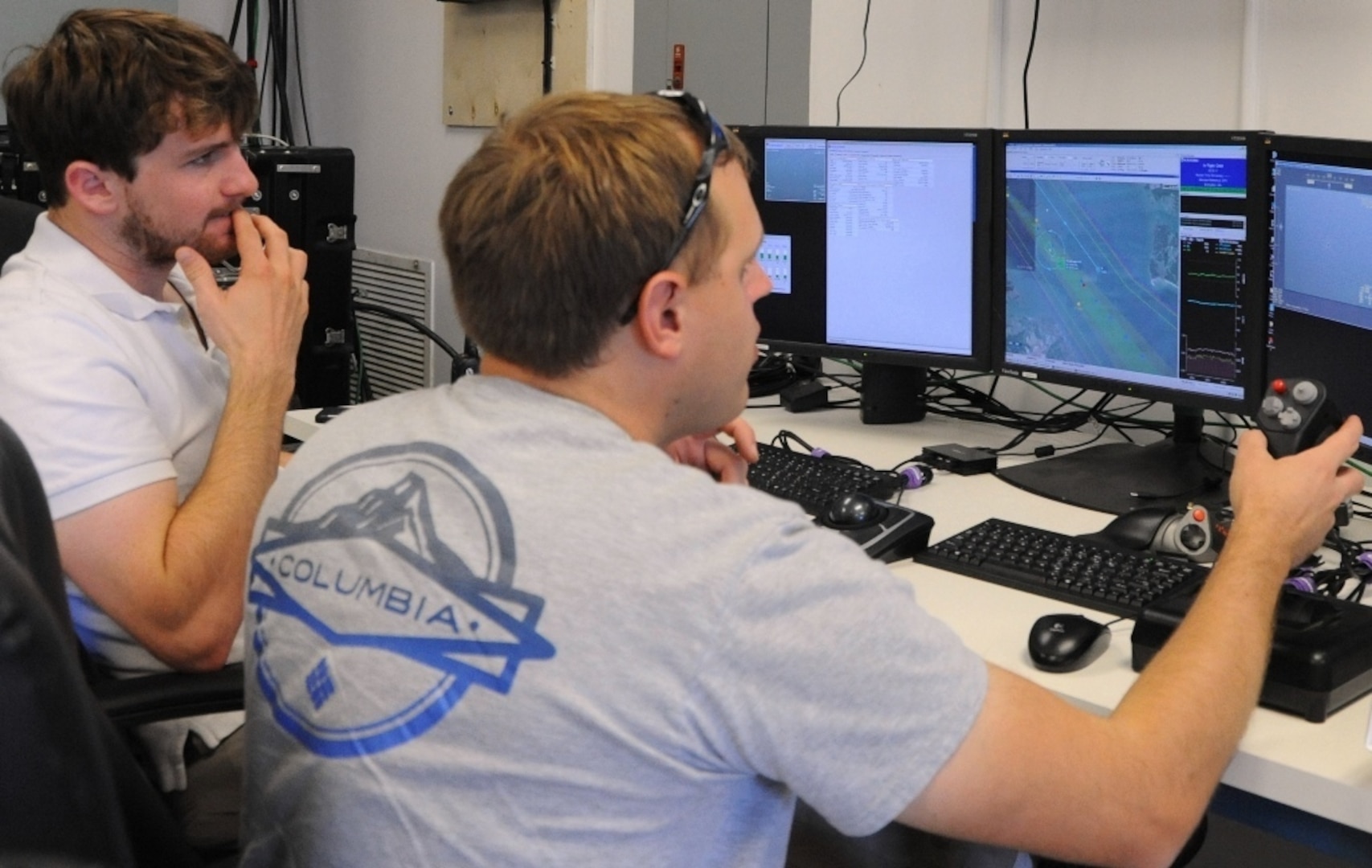 DAHLGREN, Va. -  Navy Scan Eagle unmanned aerial vehicle operators Robert Briggs and Scott Heyman conduct launch and recovery efforts via Scan Eagle at the 2016 USS Dahlgren demonstration, Aug. 30. The Scan Eagle was part of the Navy's evaluation of a strike group's gun weapon systems, combat systems, and unmanned vehicles integrated with surface and air assets at the 2016 USS Dahlgren demonstration. The test - made possible by a cybernetic laboratory called USS Dahlgren - proved engagement coordination across the battlegroup and live fire destruction of multiple targets from two combatants utilizing two different gun based systems. 