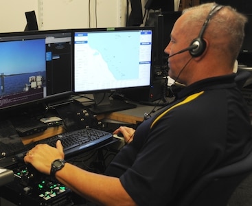 DAHLGREN, Va. - Eugene Rivers, a Navy unmanned surface vessel (USV) operator, conducts over-the-horizon contact detection and tracking in addition to battle damage assessment following engagement at the 2016 USS Dahlgren demonstration, Aug. 30. The USV was part of the Navy's evaluation of a strike group's gun weapon systems, combat systems, and unmanned vehicles integrated with surface and air assets. The virtual USS Dahlgren proved engagement coordination across the battlegroup and live fire destruction of multiple targets from two combatants utilizing two different gun based systems.  