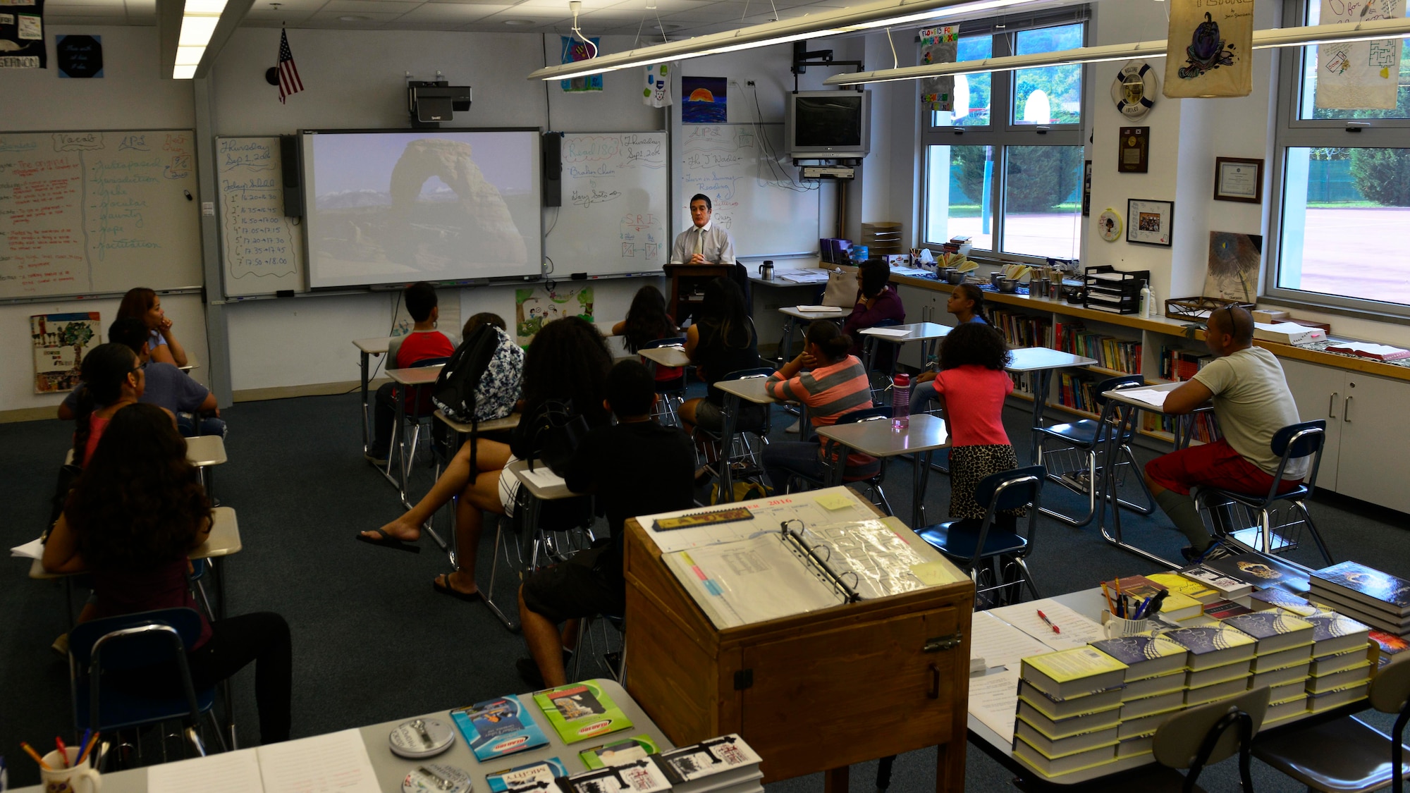 Parents and their children meet with an Aviano Middle-High School teacher during the Aviano back-to-school open house at Aviano Air Base, Italy, Sept. 1, 2016. Parents had the opportunity to meet their children’s teachers and gain a better understanding of the class curriculum. (U.S. Air Force photo by Airman 1st Class Cary Smith/Released)
