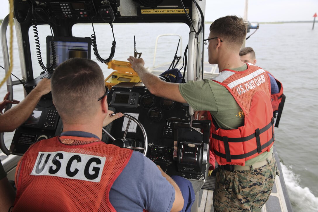 U.S. Marines with Battlefield Surveillance Company, 2nd Intelligence Battalion, regain Global Positioning System signal while boating through a channel off the coast of Oak Island, N.C., Aug. 31, 2016. The Marines teamed up with Coast Guardsmen at USCG Station Oak Island, N.C., to create a topographical layout of waterways that were previously unidentifiable. The new maps will correct navigation discrepancies such as off-station buoys or extinguished lights. (U.S. Marine Corps photo by Cpl. Kaitlyn V. Klein)