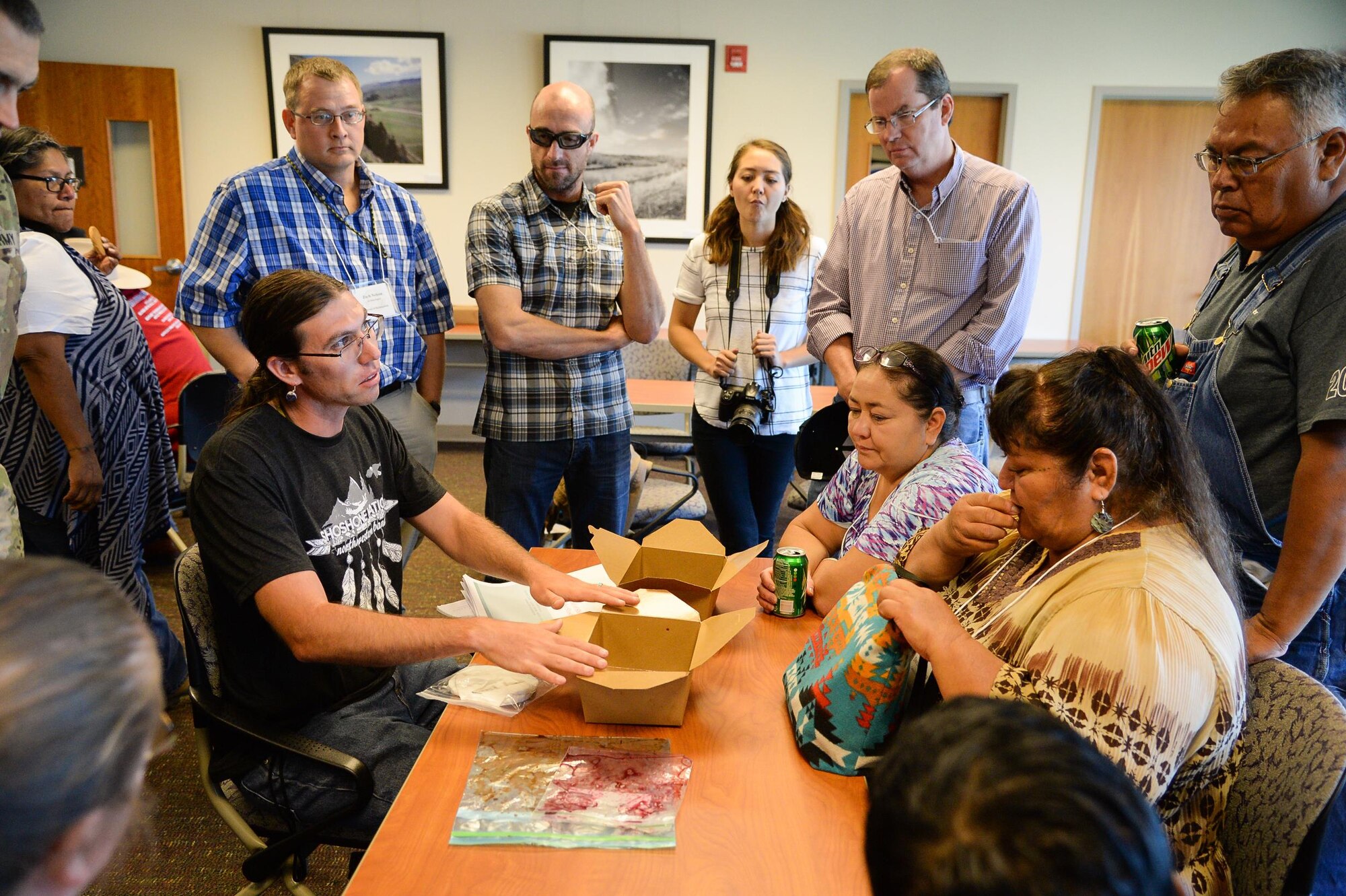 Jason Brough explains the process of making chokecherry porridge to attendees of the 2016 Annual American Indian Meeting at the Bear River Migratory Bird Refuge, Brigham City, Utah, Aug. 26, 2016. (U.S. Air Force photo by R. Nial Bradshaw)