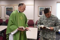Army Reserve soldiers from the command headquarters participate during religious services held at the unit's monthly battle assembly training.Various religious services are coordinated through the command chaplain's office and are available to soldiers who cannot attend their worship services due to the weekend training. 
(Photo by Spc. David Lietz)