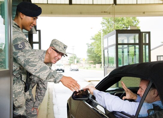 Senior leadership for the 436th and 512th Airlift Wings talk to drivers as they enter the base Sep. 1, 2016, at the north gate on Dover Air Force Base, Del. As part of the Wing's Labor Day Safety Send Off, senior leadership and the Wing Safety Office personnel reminded drivers and passengers to be safe over the Air Mobility Command's Family Day and Labor Day holiday weekend. (U.S. Air Force photo by Roland Balik)