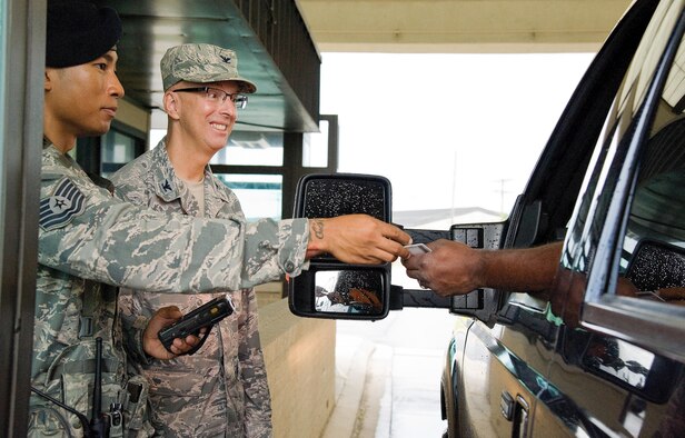 Senior leadership for the 436th and 512th Airlift Wings talk to drivers as they enter the base Sep. 1, 2016, at the north gate on Dover Air Force Base, Del. As part of the Wing's Labor Day Safety Send Off, senior leadership and the Wing Safety Office personnel reminded drivers and passengers to be safe over the Air Mobility Command's Family Day and Labor Day holiday weekend. (U.S. Air Force photo by Roland Balik)