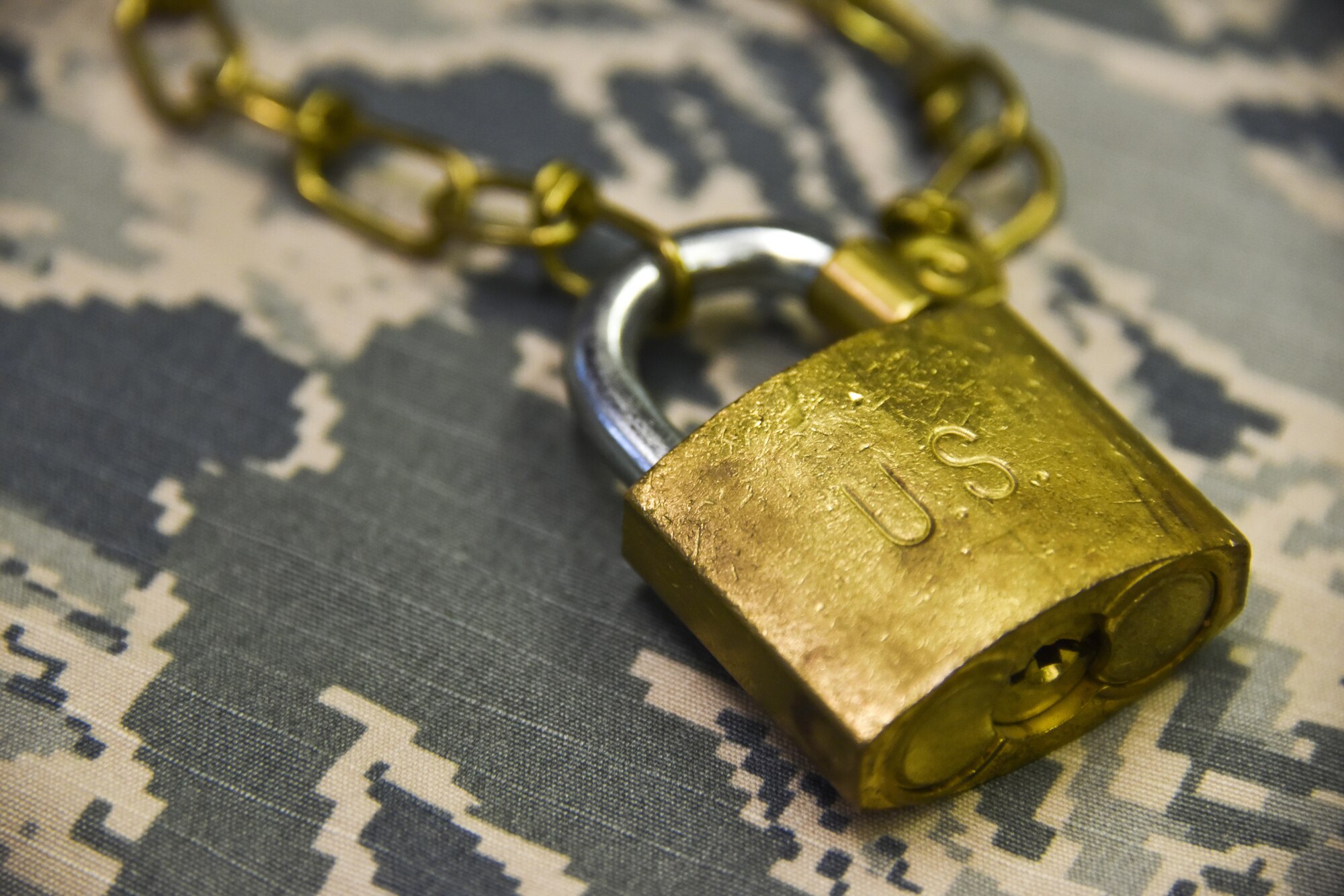 Keeping all sensitive information, such as passwords and personally identifiable information, locked away and under cover is key to maintaining a secure workplace. (U.S. Air Force photo illustration by Airman 1st Class Bethany Kobily)