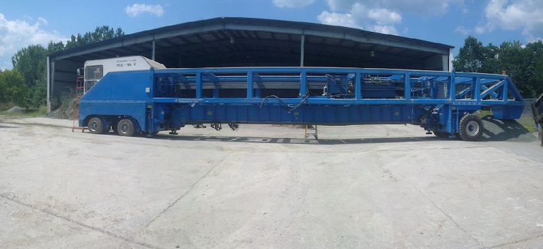 The Cold Regions Research and Engineering Laboratory's Heavy Vehicle Simulator (HVS-Mark IV) is a 75 ft long, 12 ft wide, 12 ft tall custom mechanical apparatus weighing 51 tons. The HVS  is designed to simulate a large number of vehicle passes on a full scale asphalt or concrete pavement in order to safely and quickly evaluate the effects of highway traffic on a particular pavement being tested. CRREL is part of the U.S. Army Engineer Research and Development Center.