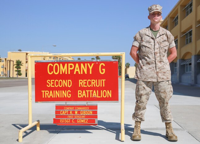 Private Jacob A. Clark, Golf Company, 2nd Recruit Training Battalion, stands next to his squad bay at Marine Corps Recruit Depot San Diego, August 30. Following recruit training, Clark will report to the School of Infantry at Marine Corps Base Camp Pendleton, Calif., and then to his military occupational specialty school to become a motor transportation operator. Annually, more than 17,000 males recruited from the Western Recruiting Region are trained at MCRD San Diego. Golf Company is scheduled to graduate September 2. 