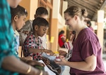 U.S. Air Force Senior Airman Makensy Lefler, 354th Dental Squadron dental technician, teaches local children how to properly brush their teeth during Pacific Angel 16-3 (PACANGEL) in Jaffna, Sri Lanka, Aug. 20, 2016. PACANGEL is a total force, joint and combined humanitarian assistance/civil military operation led by U.S. Pacific Air Forces. Assistance during PACANGEL included general health, dental, optometry and physical therapy. 
