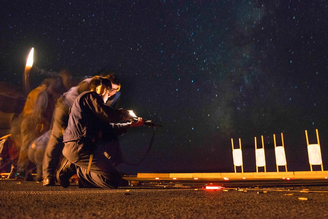 Sailors participate in a low-light M4A1 carbine qualification course on the flight deck of the aircraft carrier USS Carl Vinson in the Pacific Ocean, Aug. 31, 2016. Navy photo by Seaman Daniel P. Jackson Norgart