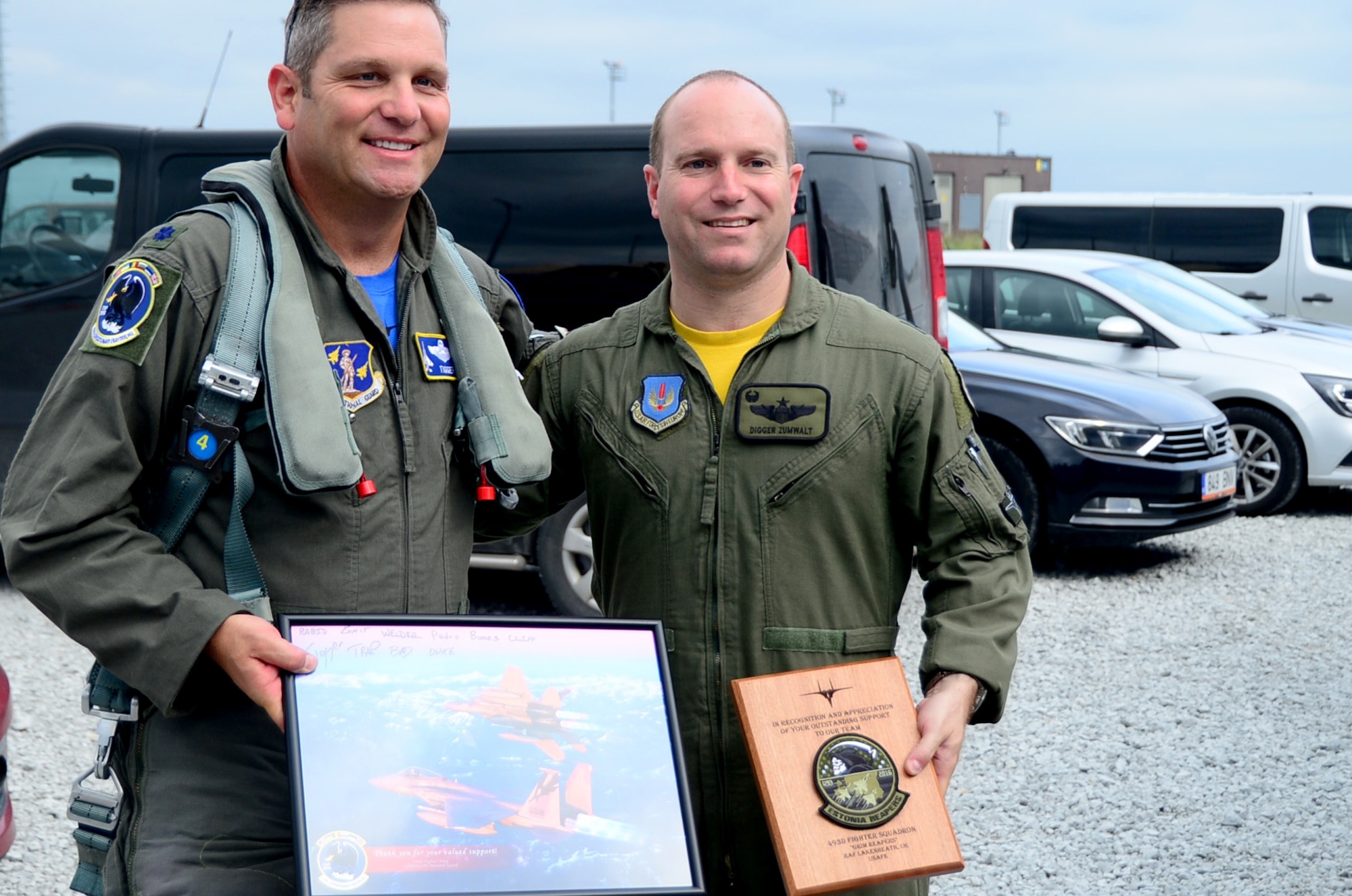 U.S. Air Force Lt. Col. Robert Swertfager, 194th Expeditionary Fighter Squadron commander, left, stands with U.S. Air Force Lt. Col. Jason Zumwalt, 493rd Fighter Squadron commander, at Ämari Air Base, Estonia, Aug. 26, 2016. The 194th and 493rd participated in a multilateral flying training deployment to build interoperability through air assurance training with allies and partners. The 194th EFS is assigned to the California Air National Guard in Fresno, and the 493rd FS is assigned to Royal Air Force Lakenheath, England. (U.S. Air Force photo by Senior Airman Erin Trower/Released)