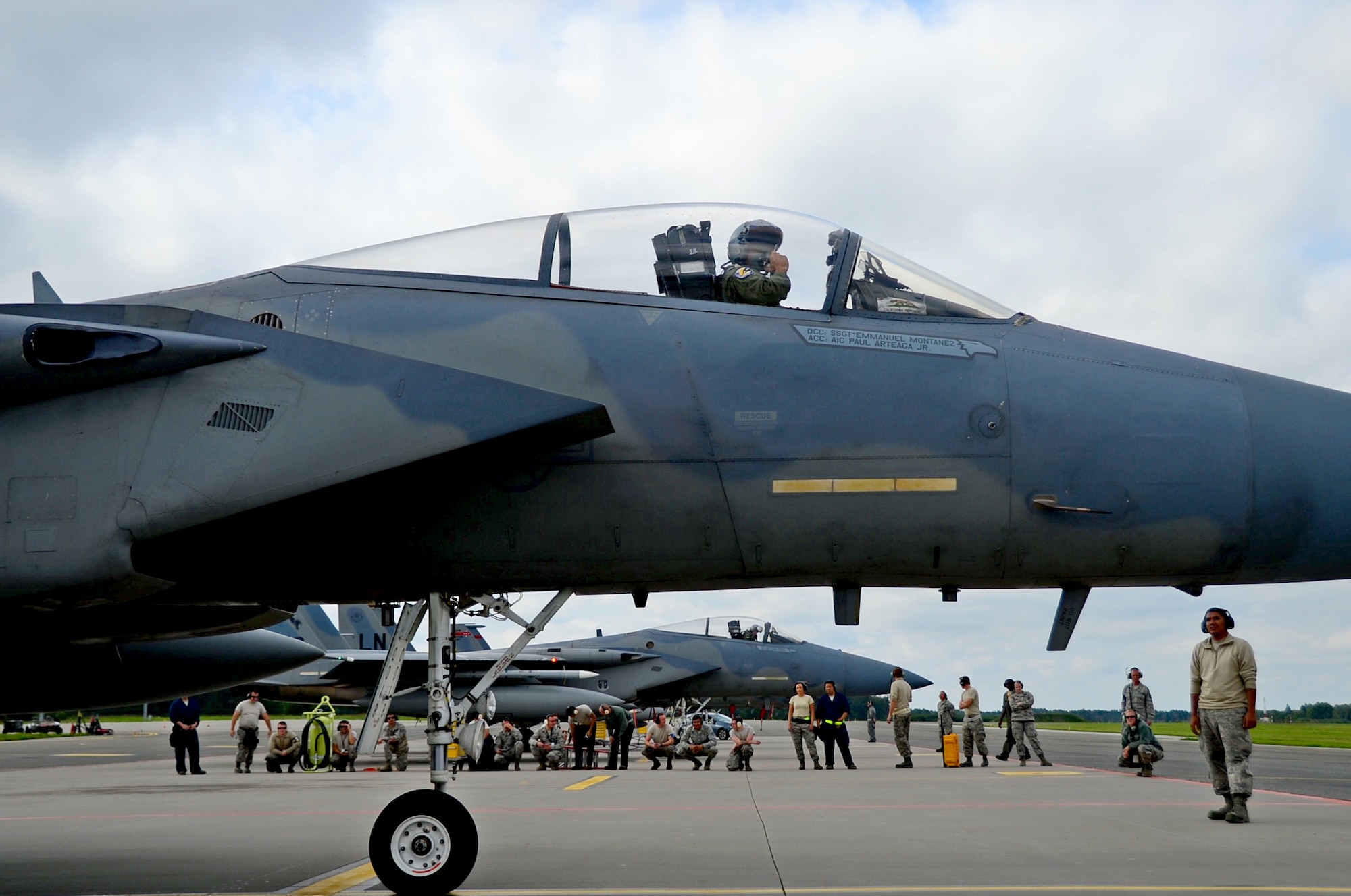 U.S. Air Force Airmen assigned to the 194th Expeditionary Fighter Squadron and the 493rd Fighter Squadron, see-off F-15C Eagle pilots assigned to the 194th EFS after completing a multilateral flying training deployment at Ämari Air Base, Estonia, Aug. 26, 2016. Aircraft and personnel from the U.S., Sweden, Finland, the U.K. and Estonia participated in flying training exercises to build interoperability and focus on dissimilar air training. (U.S. Air Force photo by Senior Airman Erin Trower/Released)