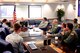 Commander of the 932nd Airlift Wing, Col. Jonathan Philebaum (next to American flag), enjoys discussing upcoming unit aircraft and maintenance issues with members of his 932nd Maintenance Group and 932nd Operations Group during a Friday meeting.  The 932nd AW, an Air Force Reserve Command unit at Scott Air Force Base, is the only flying unit in Illinois with four of the C-40C aircraft, and falls under 22nd Air Force.  (U.S. Air Force photo by Maj. Stan Paregien)