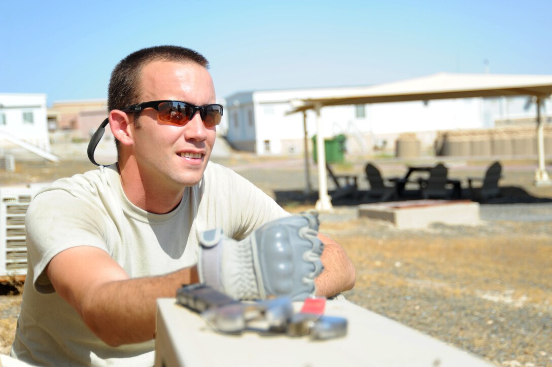 Staff Sgt. Russel Dutcher, 386th Expeditionary Civil Engineer Squadron heating, ventilation, and air conditioning technician, works on an A/C unit Aug. 9, 2016, at an undisclosed location in Southwest Asia. The 386 ECES HVAC shop is responsible for maintaining and fixing over 725 units across the base. (U.S. Air Force photo/Senior Airman Zachary Kee)