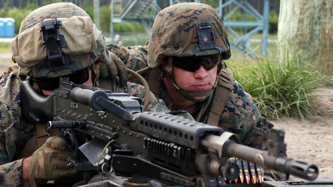 Lance Cpl. Marc Arrigo prepares to fire the M-240 Bravo as Lance Cpl. Mason McLaughlin acts as his spotter during a live-fire training exercise conducted by 2nd Low Altitude Air Defense Battalion, Marine Air Control Group 28, 2nd Marine Aircraft Wing at Marine Corps Base Camp Lejeune, N.C., Aug. 29-30. The exercise allowed Marines to re-familiarize themselves and qualify with the M-240 Bravo machine gun, M249 Squad Automatic Weapon, and the M2 Browning .50 caliber machine gun during the unknown distance live-fire exercise. Arrigo and McLaughlin are gunners with 2nd LAAD.