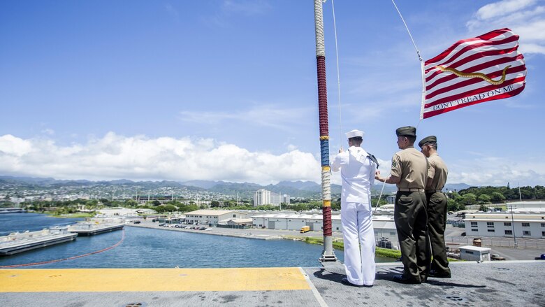 U.S. Marines and Sailors with the 13th Marine Expeditionary Unit and Boxer Amphibious Ready Group moore raise the colors aboard the USS Boxer, Joint Base Pearl Harbor-Hickman Pier, Hawaii, Aug. 29, 2016. The 13th MEU, embarked on the Boxer Amphibious Ready Group, is operating in the U.S. 3rd Fleet area of operations in support of security and stability in the Pacific region.