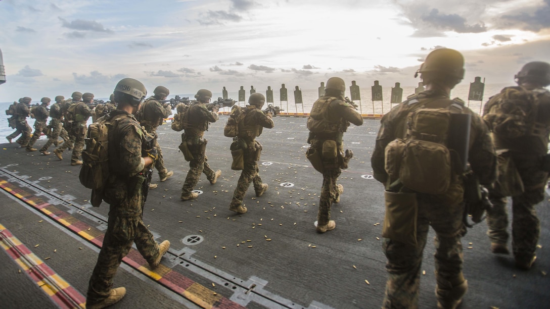 U.S. Marines with the 13th Marine Expeditionary Unit's Maritime Raid Force conduct a moving drill during a live-fire range aboard the USS Boxer (LHD 4), July 29, 2016. The 13th MEU is conducting sustainment training to maintain proficiency and combat readiness while deployed with the Boxer Amphibious Ready Group during Western Pacific Deployment 16-1.