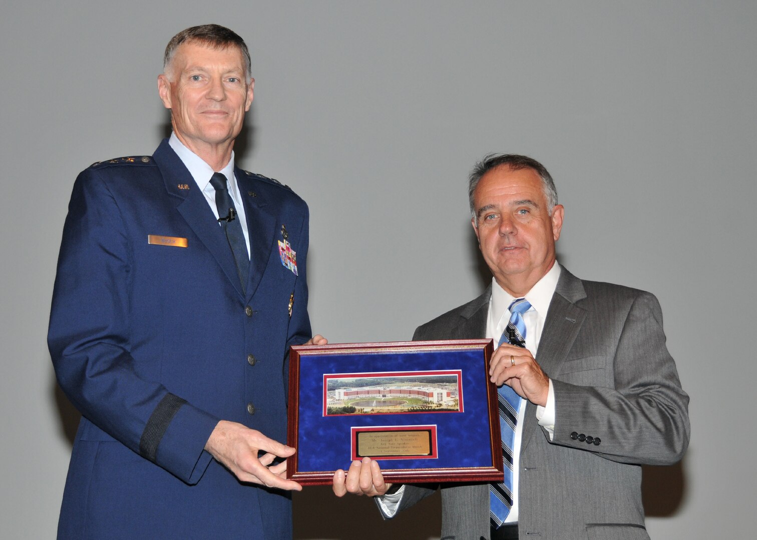 Lt. Gen. Andy Busch presents FEMA Deputy Administrator Joseph Nimmich a certificate of appreciation. 