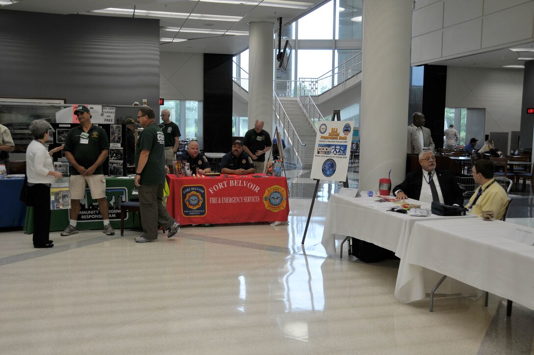 Personnel from Fort Belvoir Fire and Emergency Services and other first responders offer information during the National Preparedness Month Expo in the McNamara HQC cafeteria, Sept. 1.