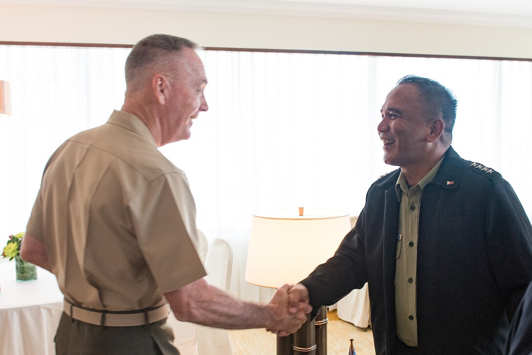 Marine Corps Gen. Joe Dunford, chairman of the Joint Chiefs of Staff, shakes hands with with Philippine Armed Forces Chief of Staff Gen. Ricardo Visaya in Manila, the Philippines, Sept. 5, 2016. Dunford was in Manilla to attend the 2016 Chiefs of Defense Conference. The conference brings together military leaders to discuss regional and global challenges and to promote cooperation in the Indo-Asia-Pacific region. DoD photo by Army Sgt. James K. McCann