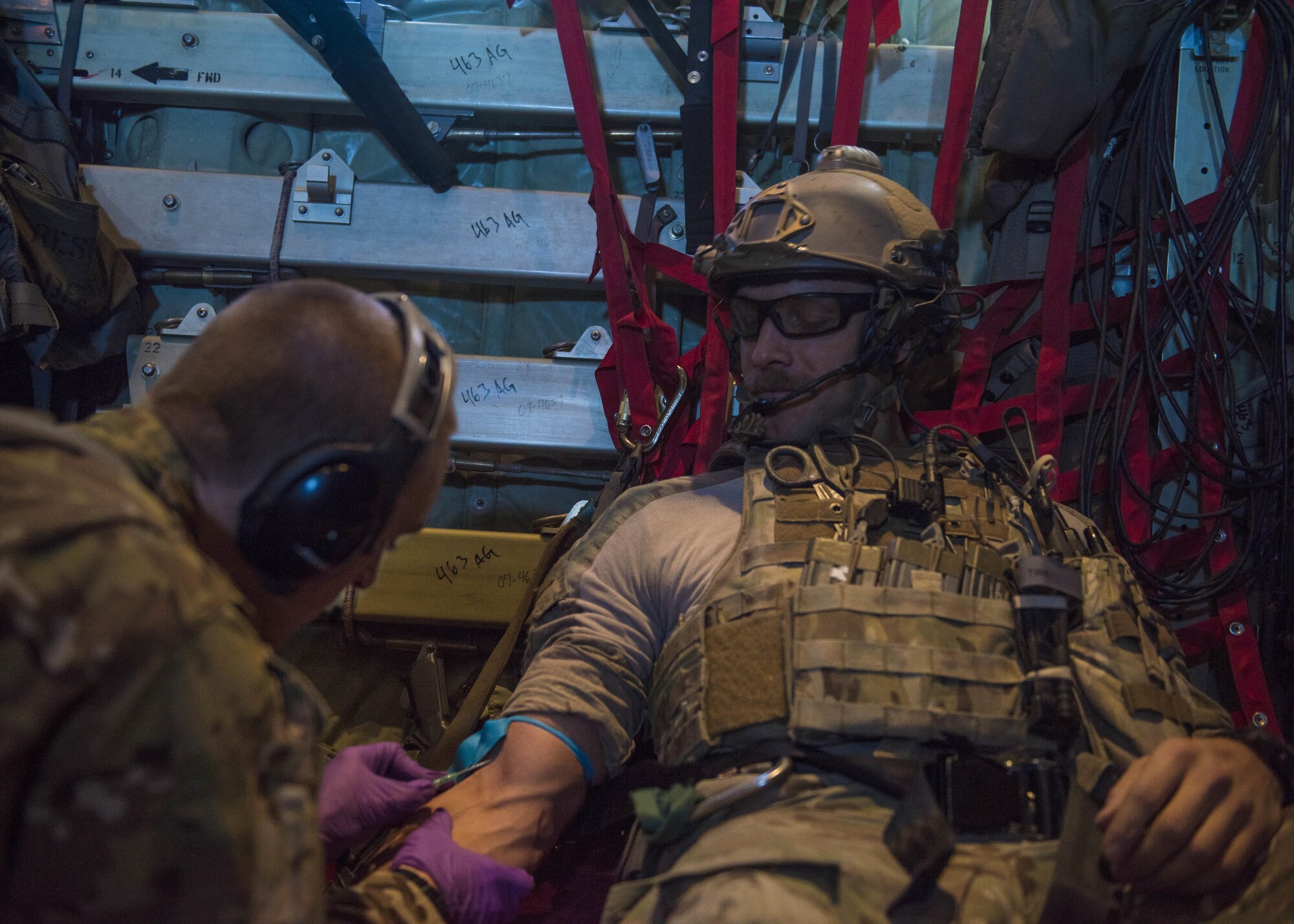Staff Sgt. Roderick Campbell, 83rd Expeditionary Rescue Squadron, has an intravenous needle placed into his arm, Bagram Airfield, Afghanistan, Sept. 03, 2016. Airmen from the 83rd ERQS, paired with airmen from the 455th Expeditionary Aeromedical Evacuation Squadron to increase interoperability with each other and demonstrate theater personnel recovery capabilities. (U.S. Air Force photo by Senior Airman Justyn M. Freeman)