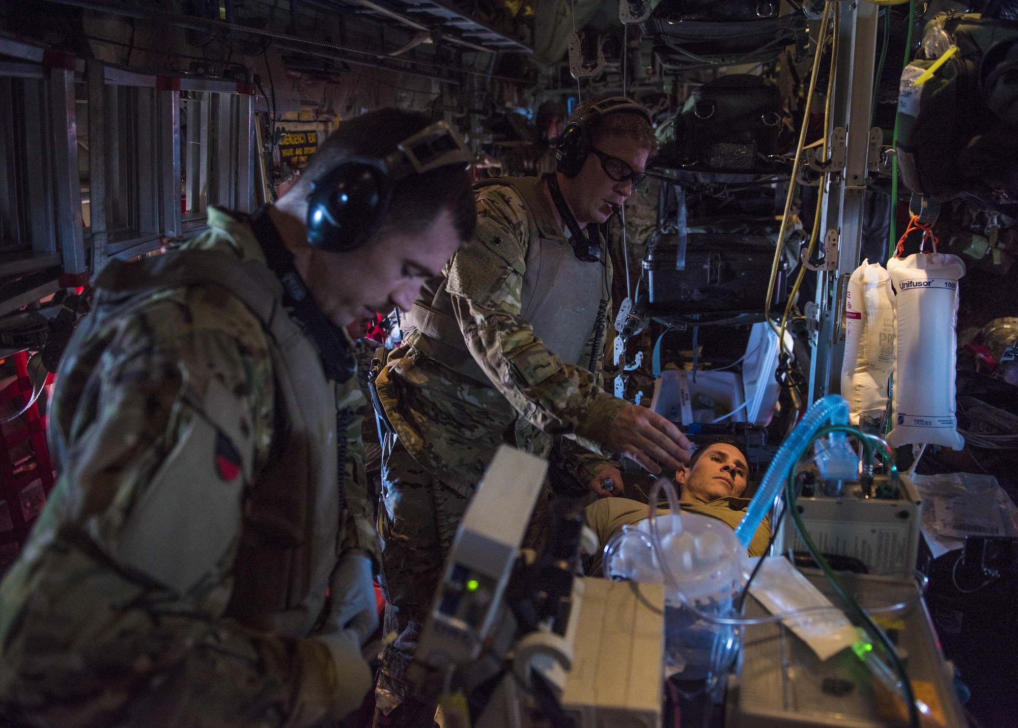 Capt. Antonio Stone (left), 455th Expeditionary Aeromedical Evacuation Critical Care Air Transport Team nurse, and Maj. Johnathan Henderson (right), 455th EAES CCATT doctor, puts in a chest tube for a simulated wounded patient, Bagram Airfield, Afghanistan, Sept. 03, 2016. If servicemembers must be moved from the battlefield to a medical facility outside of Afghanistan, the airmen assigned to the 455th EAES will be the link between them getting from the combat zone to higher-level medical care. (U.S. Air Force photo by Senior Airman Justyn M. Freeman)