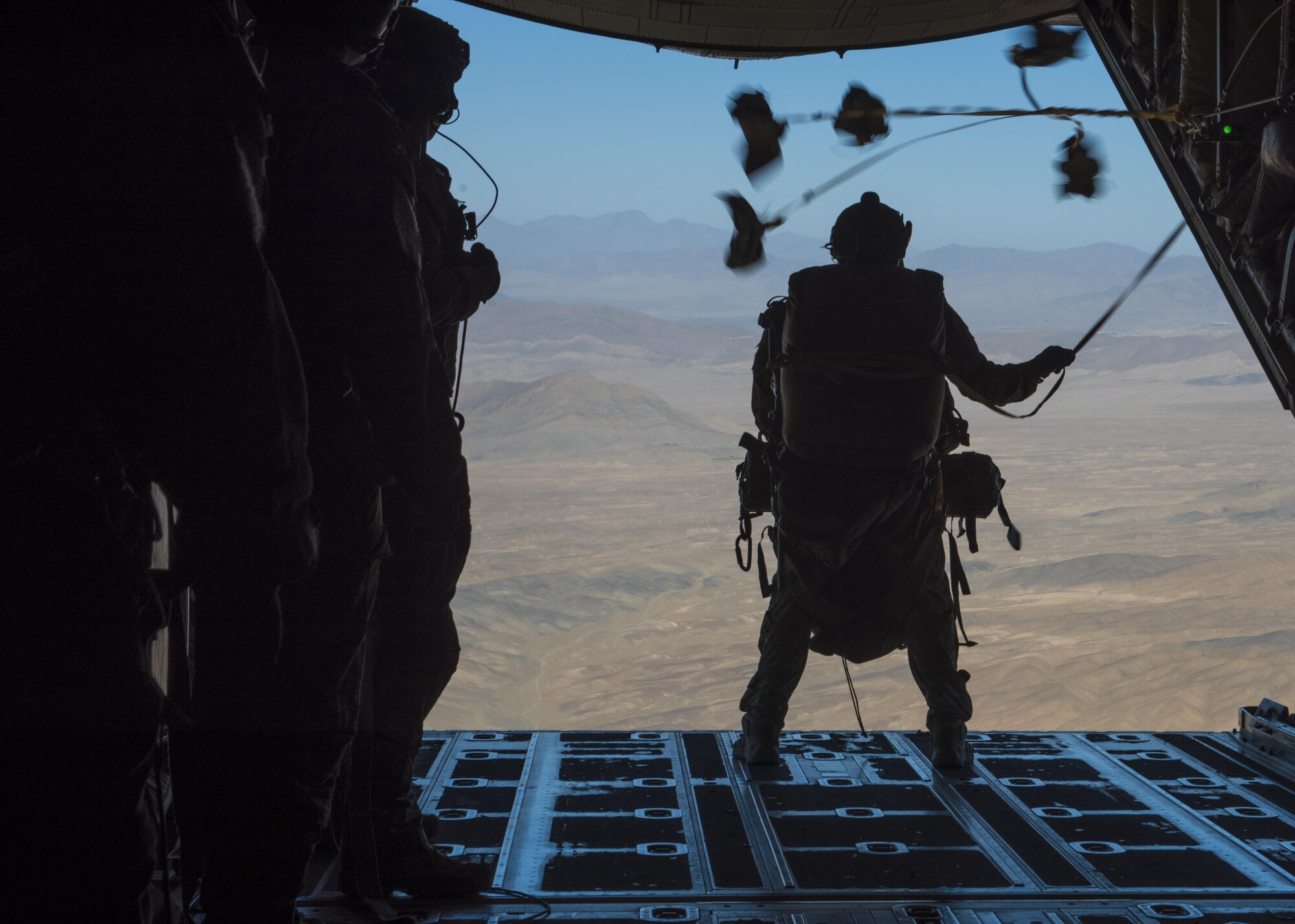 Staff Sgt. Benjamin Cole, 83rd Expeditionary Rescue Squadron pararescueman, prepares to jump off a C-130J Super Hercules ramp during a recovery exercise, Bagram Airfield, Afghanistan, Sept. 03, 2016. The 83rd ERQS participates in a real world scenario exercises in order to maintain readiness standards and demonstrate theater personnel recovery capabilities. (U.S. Air Force photo by Senior Airman Justyn M. Freeman)