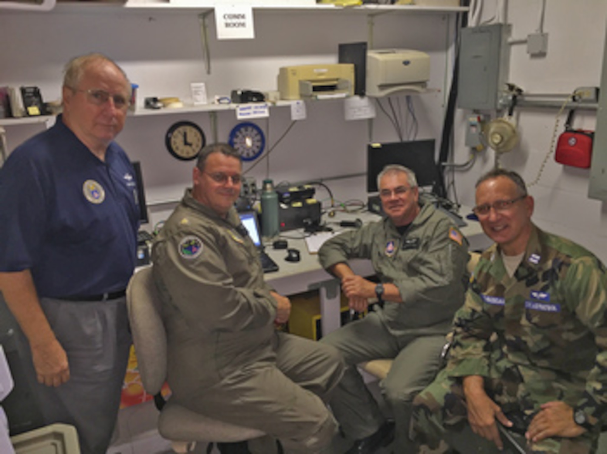 Emergency locator transmitter personnel (from left) Lt. Col. Carl Kretzer and Maj. Gary Stalnaker, mission pilots, and Capts. Richard Ross, mission observer, and Mark Thibodeau, safety officer, review a successful find. (Photo by CAP Lt. Col. Rodger Helton)
