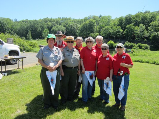 Park Hosts Maria and Dennis Dube, Ted Robbins, Patrick Shull, Sharon Clark, Brenda Goessling and Brian Phelps assist Park Rangers Jean Hixson and Glenna Vitello pass out safety material before the derby.