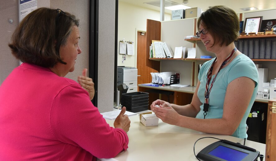 A military dependent picks up her prescription Sept. 1, 2016, at Malmstrom Air Force Base, Mont. The Air Force wide Urgent Care Pilot program became effective May 23, 2016, allowing TRICARE Prime members two visits per fiscal year to a network TRICARE authorized provider without a referral or prior authorization. (U.S. Air Force photo/Senior Airman Jaeda Tookes)
 
